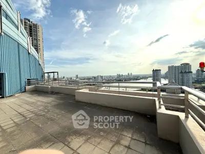 Stunning rooftop view with expansive cityscape and river, perfect for urban living enthusiasts.