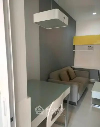 Modern living room with sleek furniture and stylish decor in a contemporary apartment.