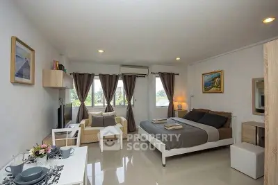 Spacious studio apartment with modern decor and natural light
