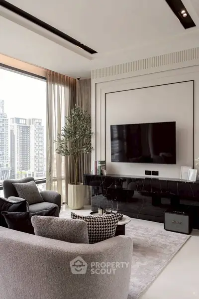 Modern living room with large window and city view, featuring stylish furniture and a mounted TV.
