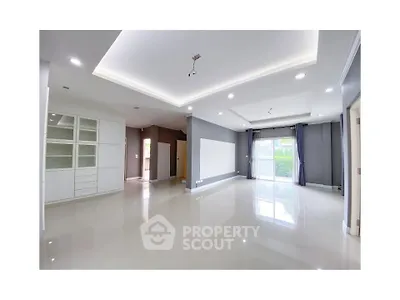 Spacious modern living room with large windows and sleek design