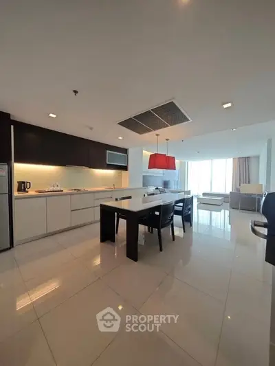 Spacious modern kitchen with open layout and sleek dining area