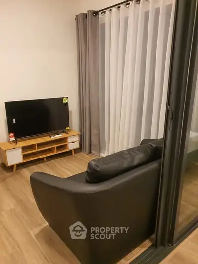 Cozy living room with modern decor and large window view