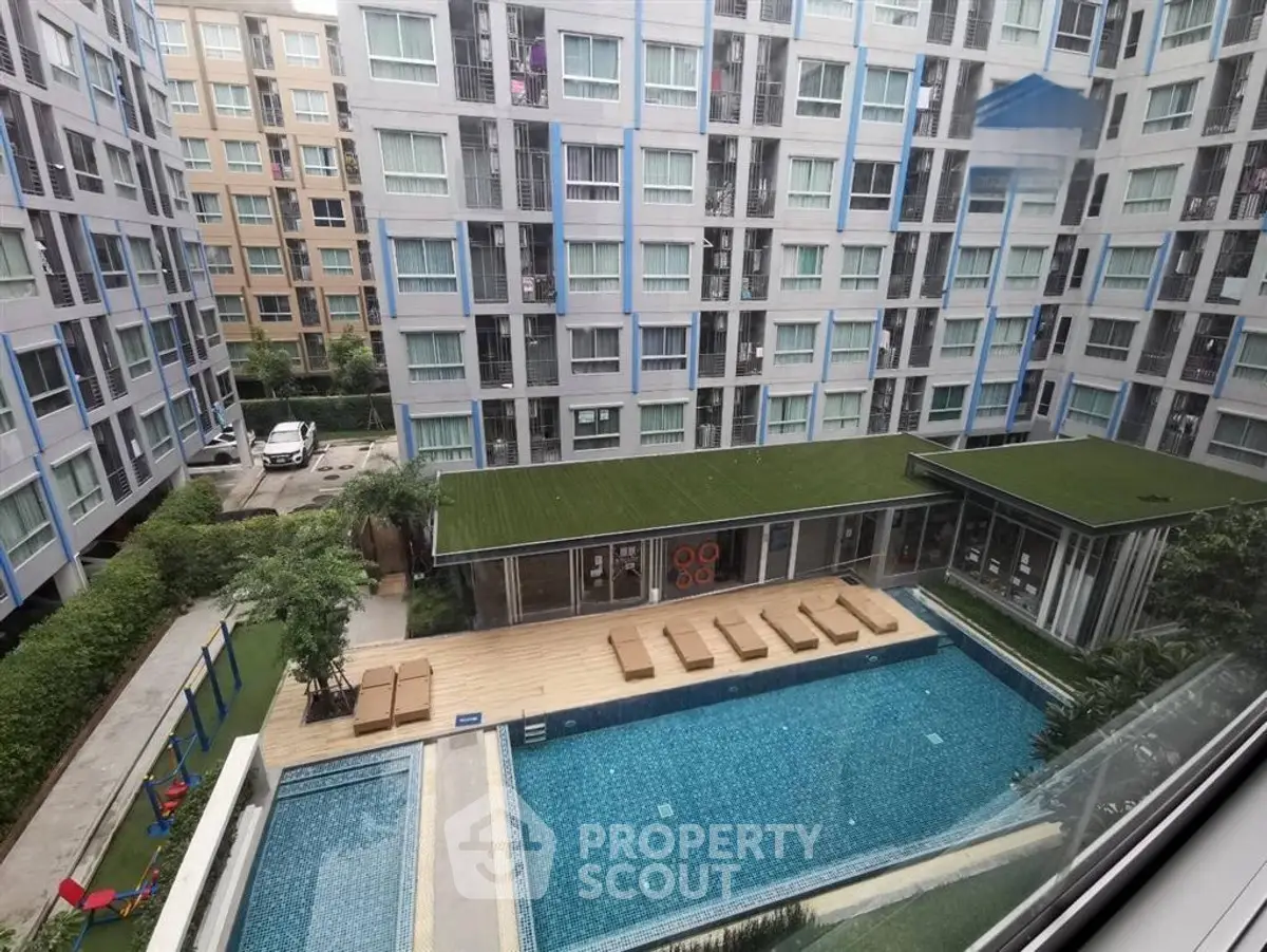 Modern apartment complex with pool view and stylish architecture
