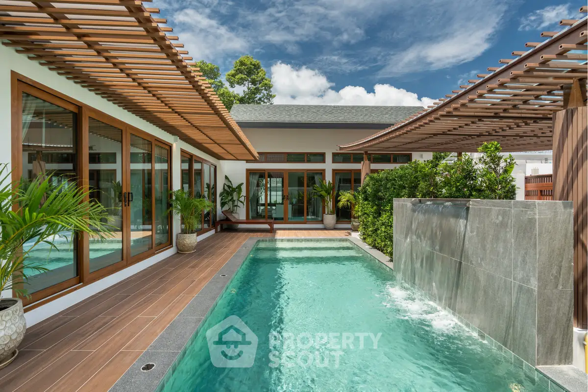 Luxurious modern villa with private pool and elegant wooden accents under a clear blue sky.