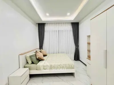 Modern minimalist bedroom with elegant decor and natural light