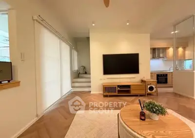 Modern living room with stylish decor and open kitchen layout