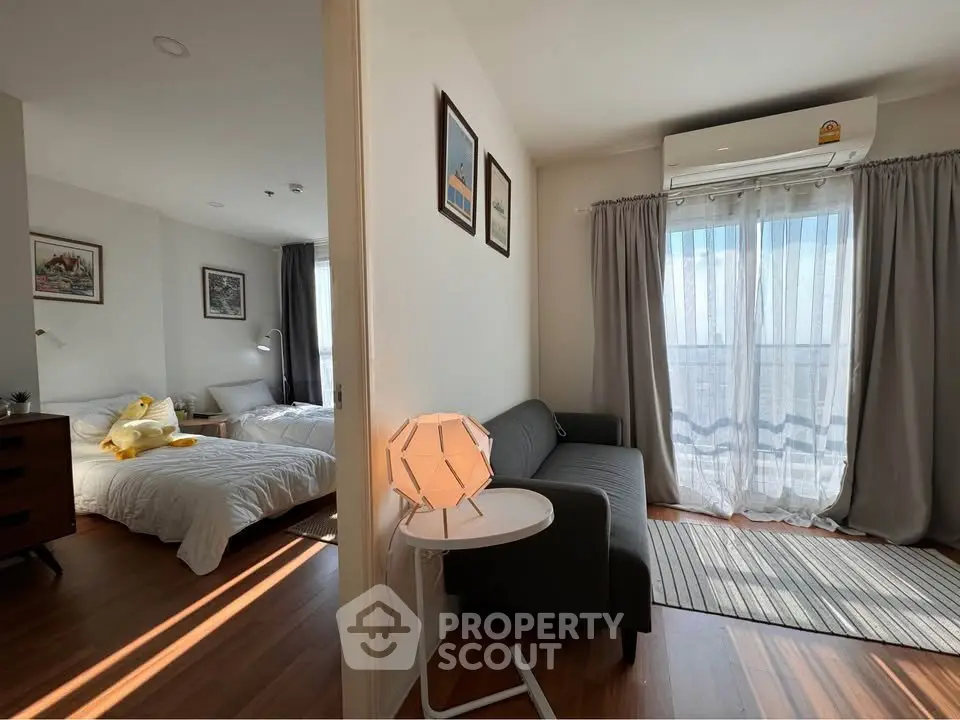Modern apartment with cozy living room and bright bedroom, featuring stylish decor and natural light.