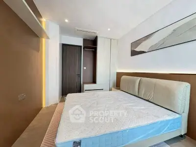 Modern bedroom with stylish decor and comfortable bed in a contemporary apartment.