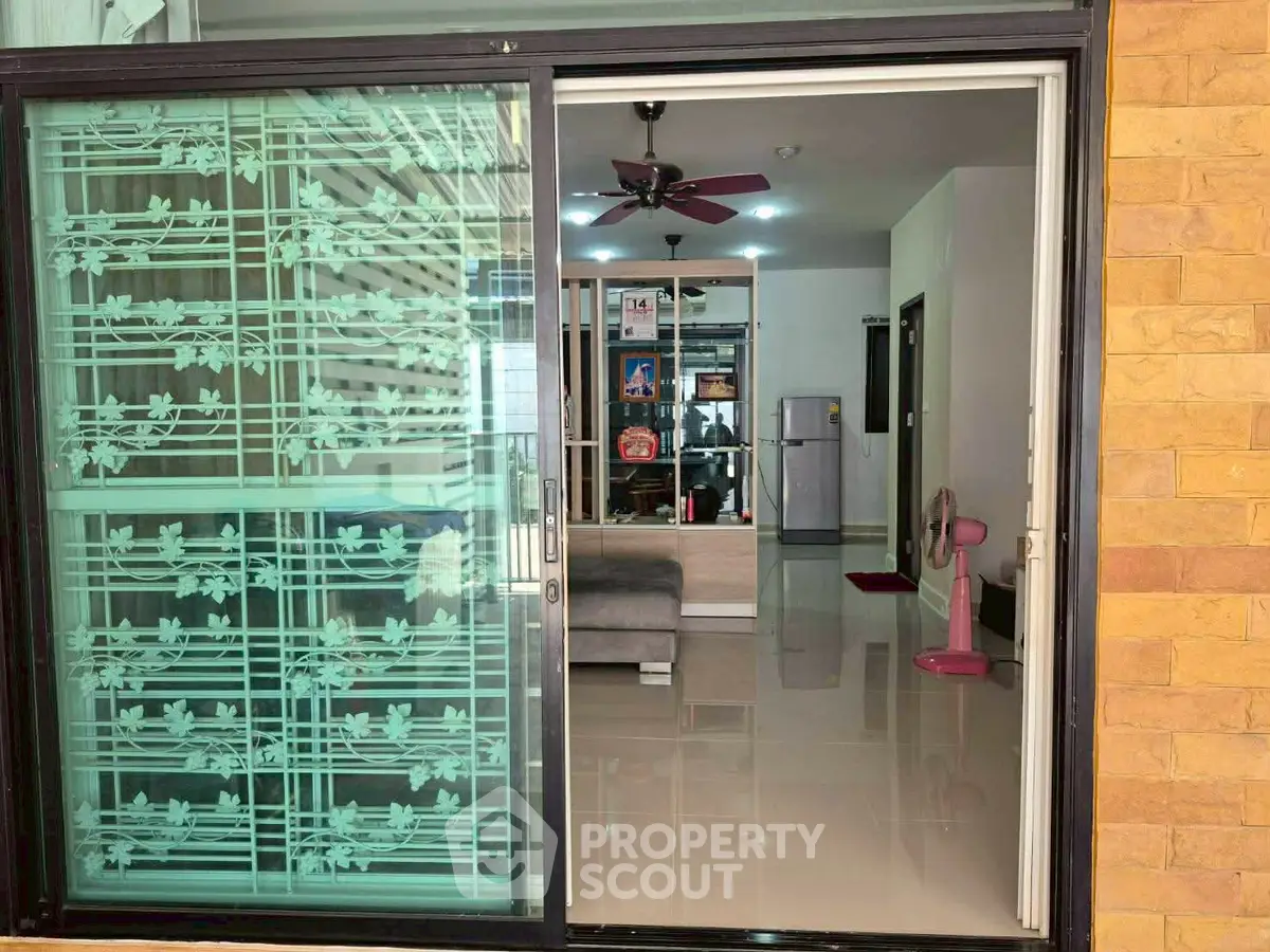 Modern living room with sliding glass door and stylish interior design