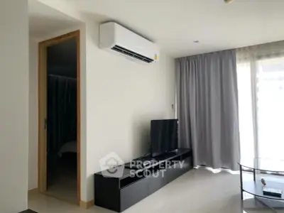 Modern living room with air conditioning and sleek furniture in a bright apartment.