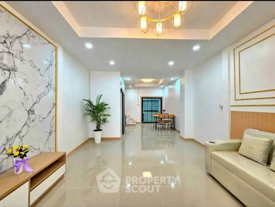 Spacious modern living room with elegant decor and open dining area