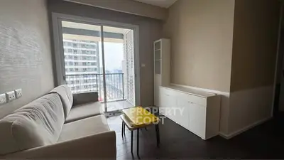 Modern living room with balcony view in high-rise apartment