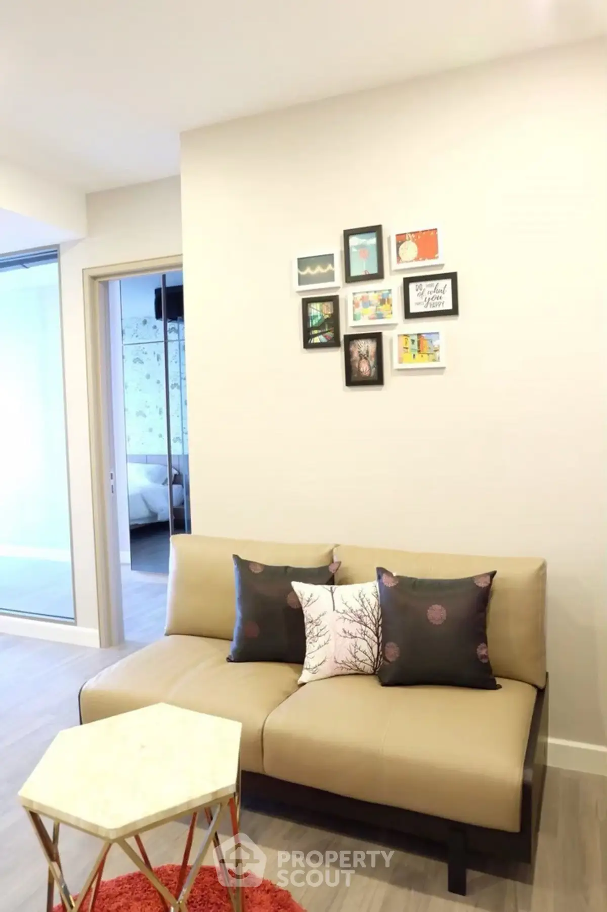 Cozy living room with stylish sofa and wall art in modern apartment.