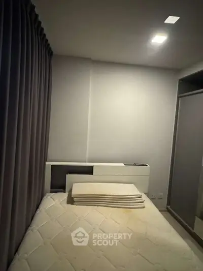 Cozy bedroom with modern design and ample natural light