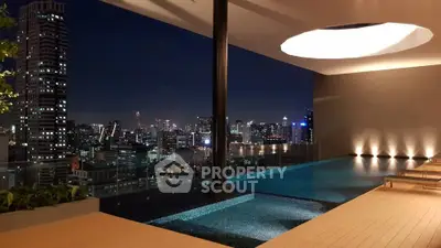 Luxurious rooftop pool with stunning city skyline view at night