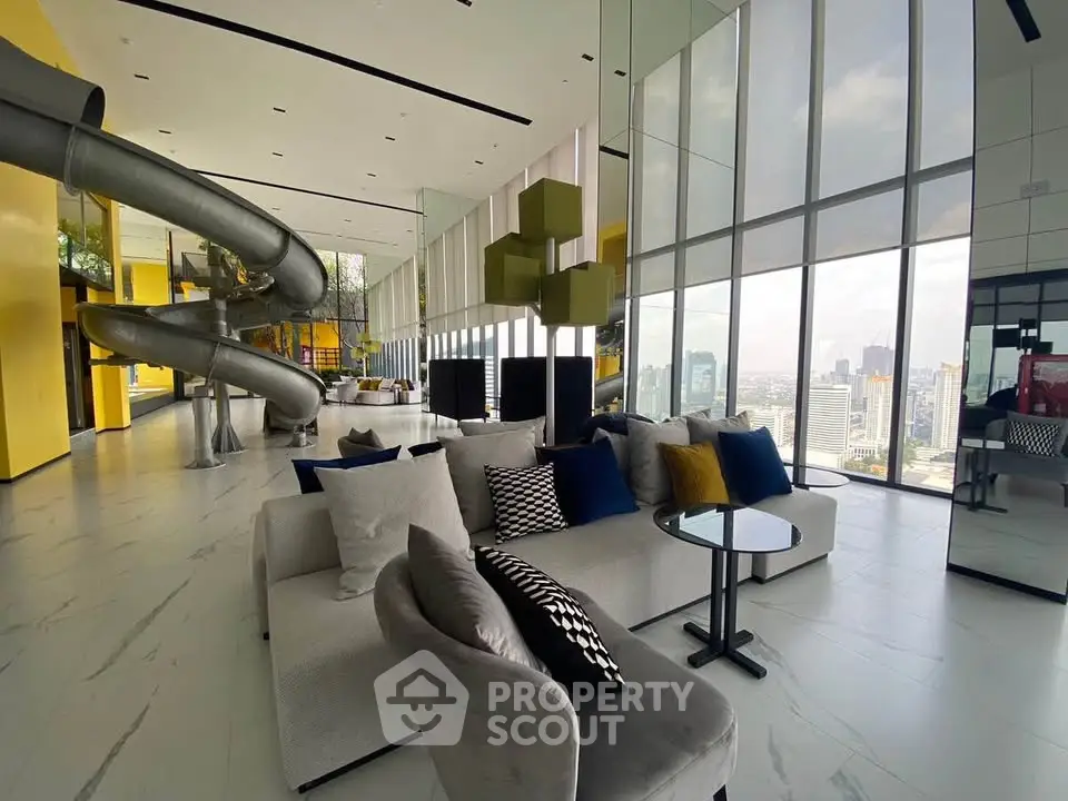 Luxurious modern living room with panoramic city views and unique slide feature.