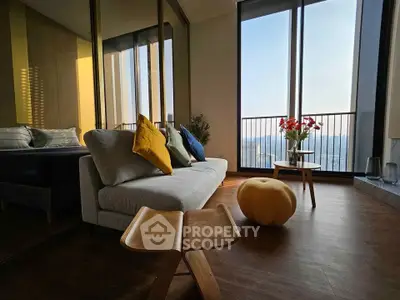 Modern living room with stylish decor and large windows offering stunning views.
