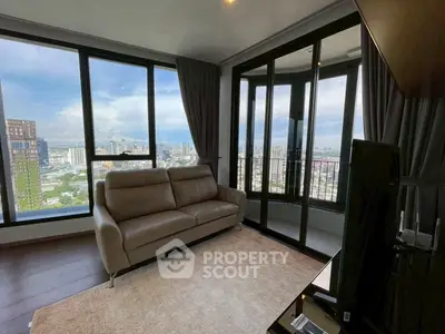 Spacious living room with panoramic city view and modern furnishings.
