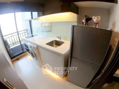 Modern kitchen with sleek appliances and balcony view