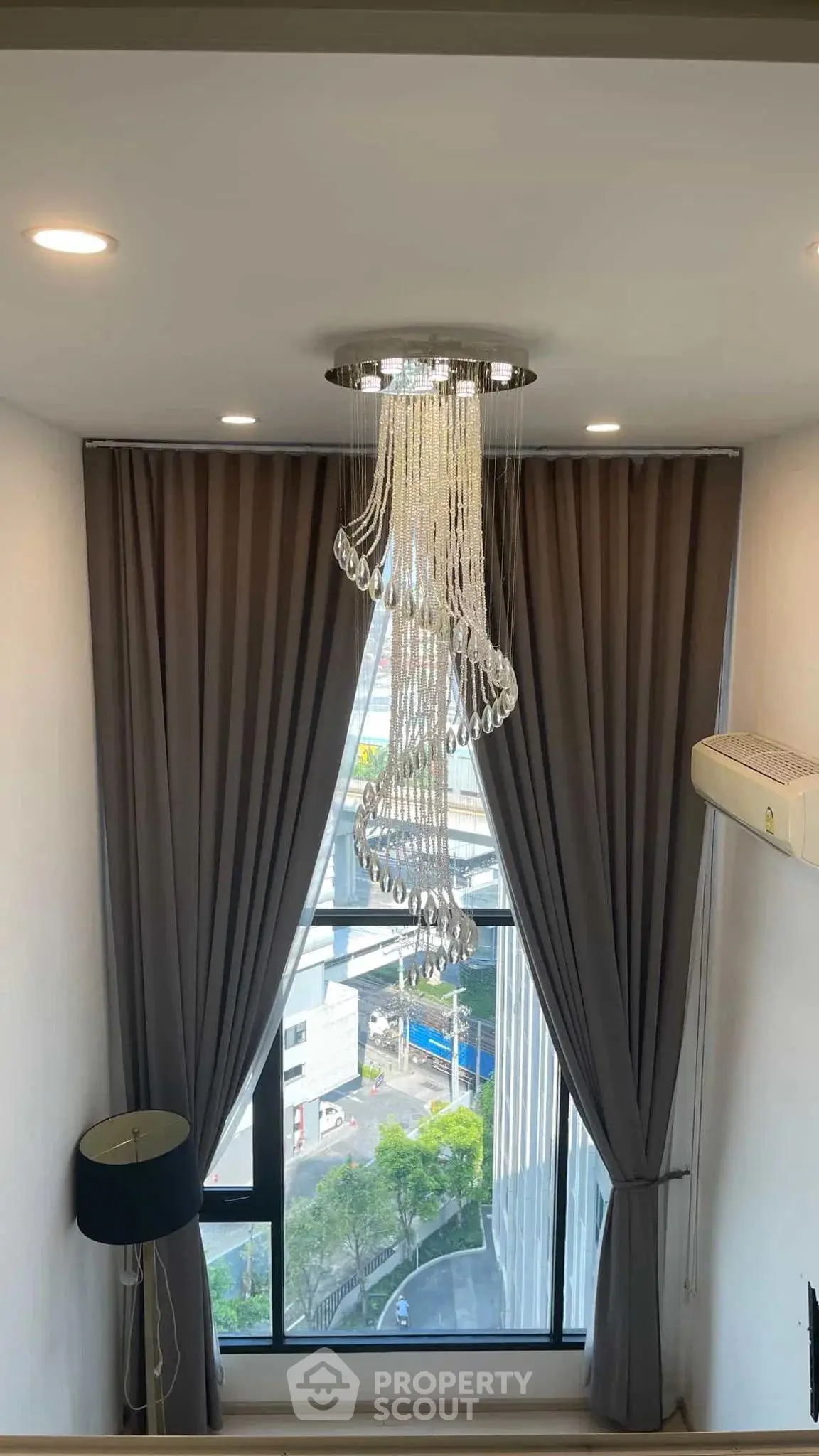 Elegant interior with modern chandelier and large window view