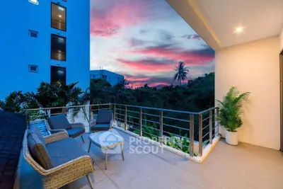 Stunning balcony with modern seating and breathtaking sunset view