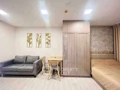 Modern studio apartment with cozy living area and stylish decor