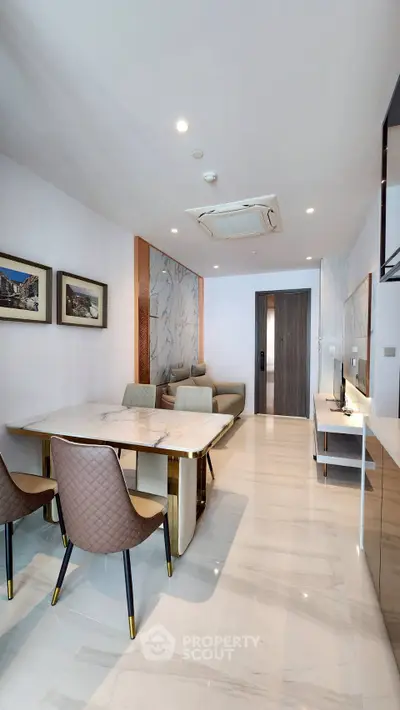 Modern living room with elegant marble flooring and stylish furniture in a contemporary apartment.