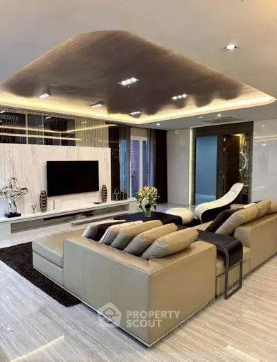 Luxurious modern living room with elegant decor and spacious seating area.