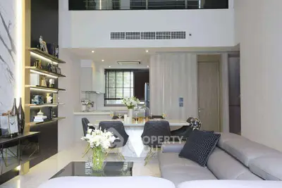 Luxurious modern living room with open kitchen and elegant decor