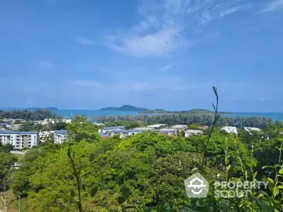 Stunning coastal view with lush greenery and ocean horizon, perfect for serene living.