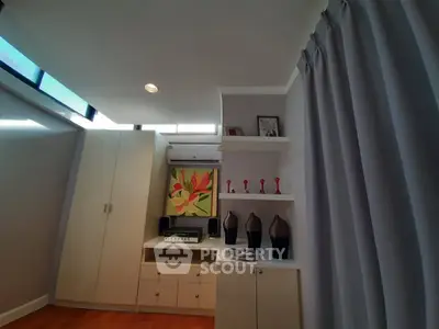 Stylish modern living room with elegant decor and ample natural light.