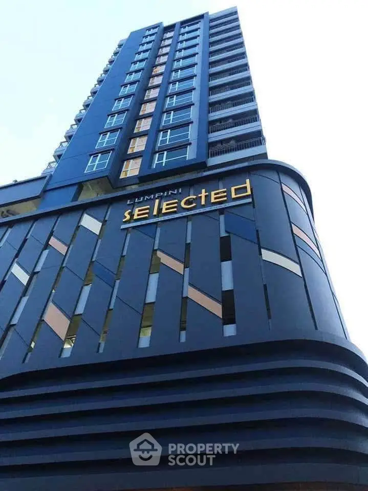 Modern high-rise building with unique architectural design and stylish facade.
