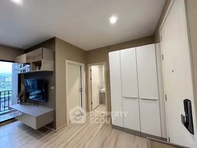 Modern living room with balcony view and sleek storage solutions