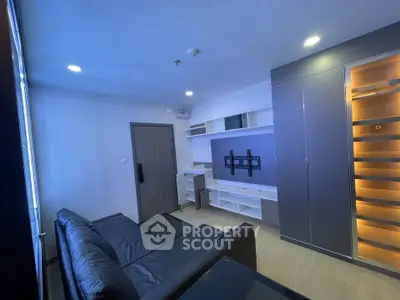 Modern living room with sleek furniture and built-in shelving, perfect for urban living.