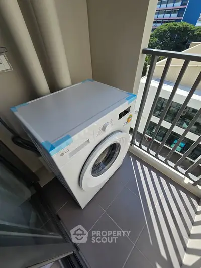 Modern balcony with washing machine, perfect for urban living convenience.