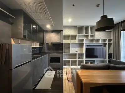 Modern open-plan kitchen and living room with sleek design and built-in shelving.