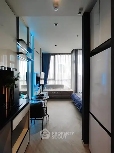 Modern studio apartment with sleek design and large windows