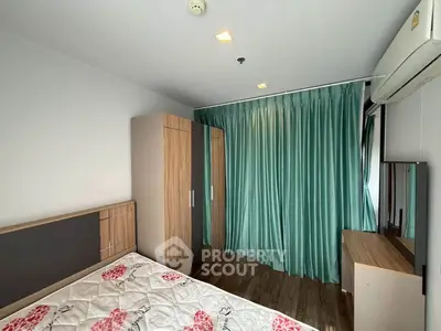 Modern bedroom with wooden wardrobe, air conditioning, and stylish curtains in a cozy apartment.