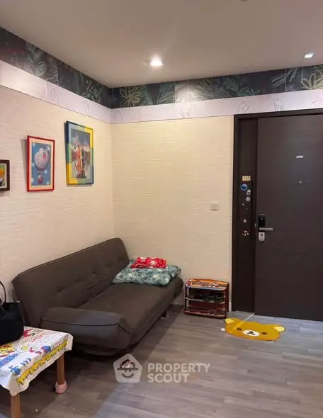 Cozy living room with modern decor and comfortable seating in a stylish apartment.