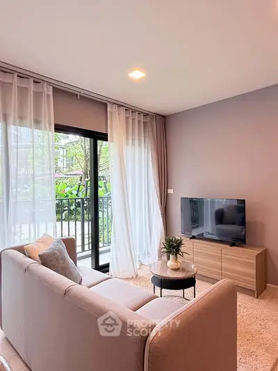 Modern living room with cozy sofa, TV, and balcony view in stylish apartment.
