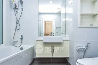 Modern bathroom with sleek fixtures and spacious bathtub