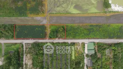 Aerial view of a lush green plot of land ideal for development.
