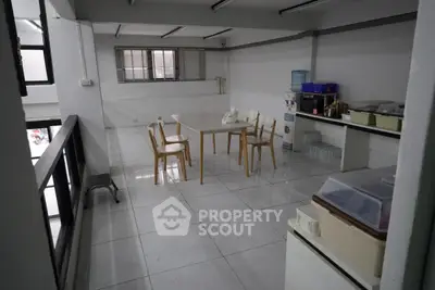 Spacious office pantry with modern furniture and natural lighting
