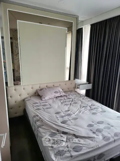Modern bedroom with stylish decor and large windows for natural light