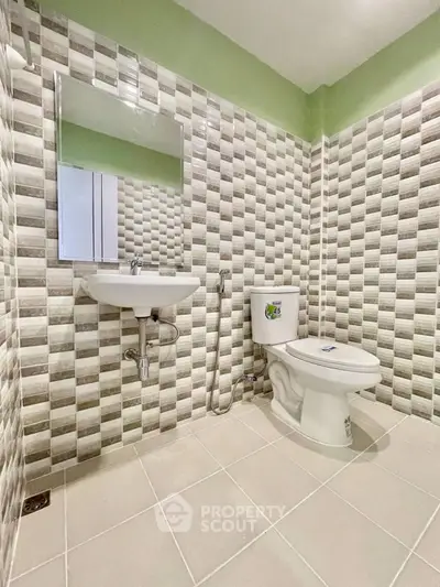 Modern bathroom with stylish tiled walls and sleek fixtures