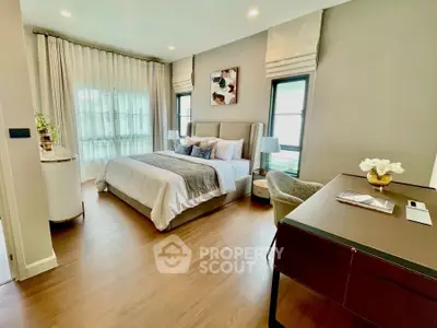 Luxurious bedroom with elegant decor and natural light