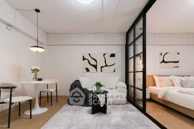 Modern studio apartment with stylish decor and cozy bedroom area