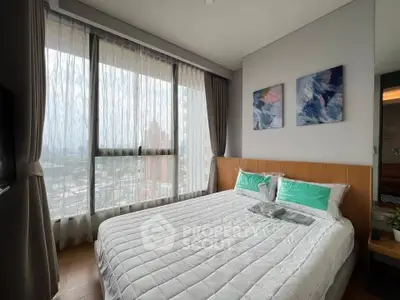 Modern bedroom with large window and stylish decor in high-rise apartment.