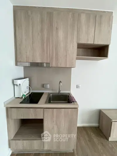 Modern kitchen with sleek cabinetry and built-in appliances